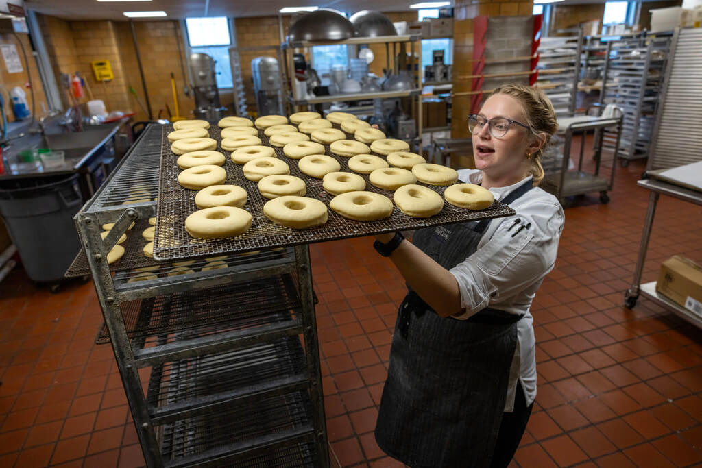 Before frying, the donuts go into an industrial proofer to rise. This can take anywhere from 10 to 30 minutes depending on the time of year, temperature and humidity in the kitchen.