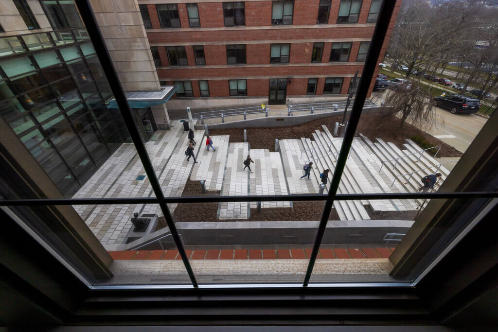 Students walk across a courtyard