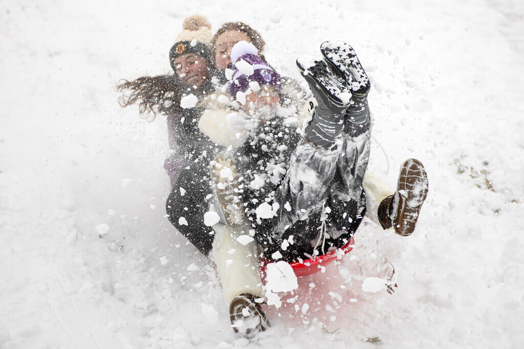 Three women on a sled