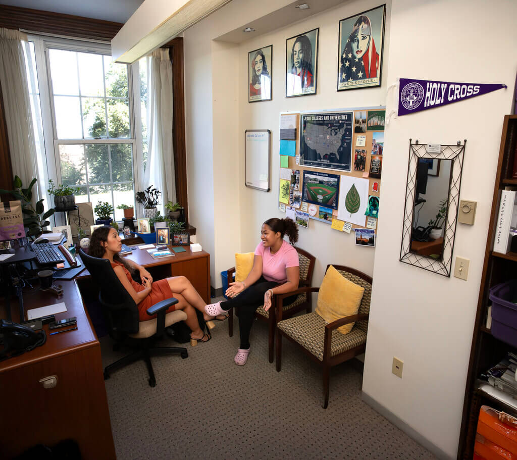 Two women sit in an office