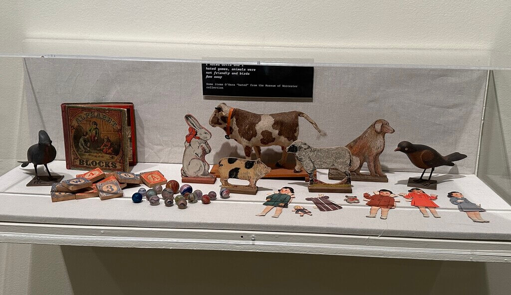 Vintage toys in a glass display case.