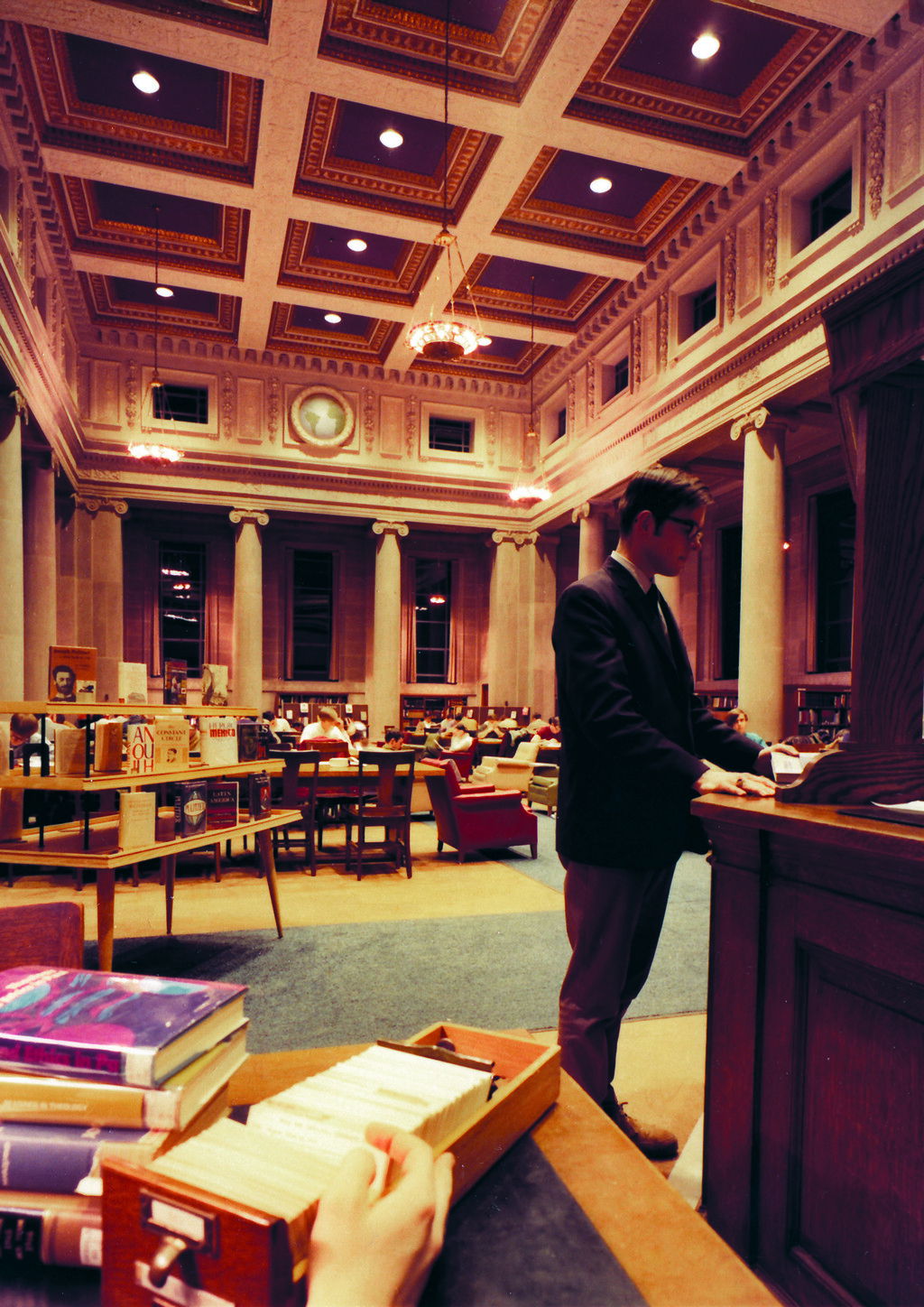 Student standing in reading room
