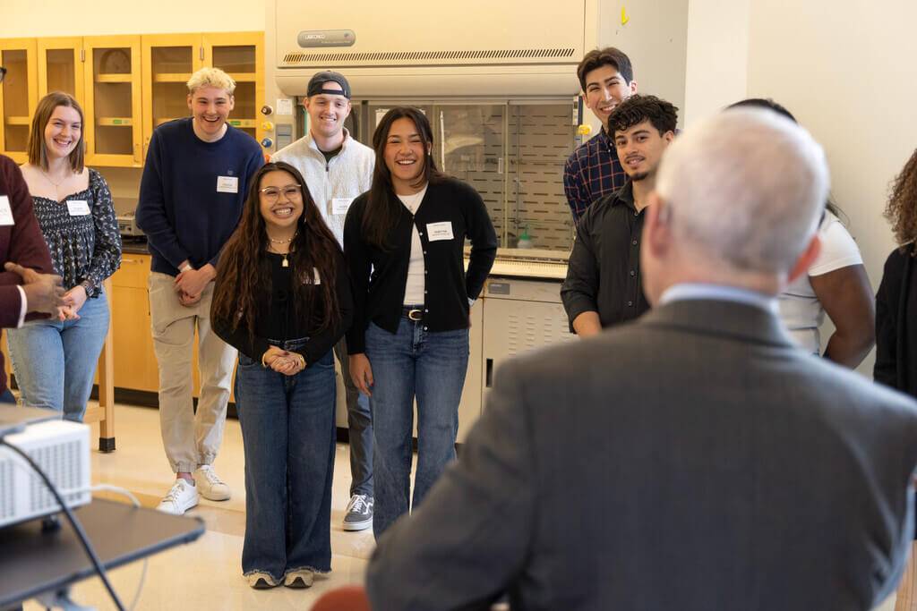 Students listening to Anthony Fauci