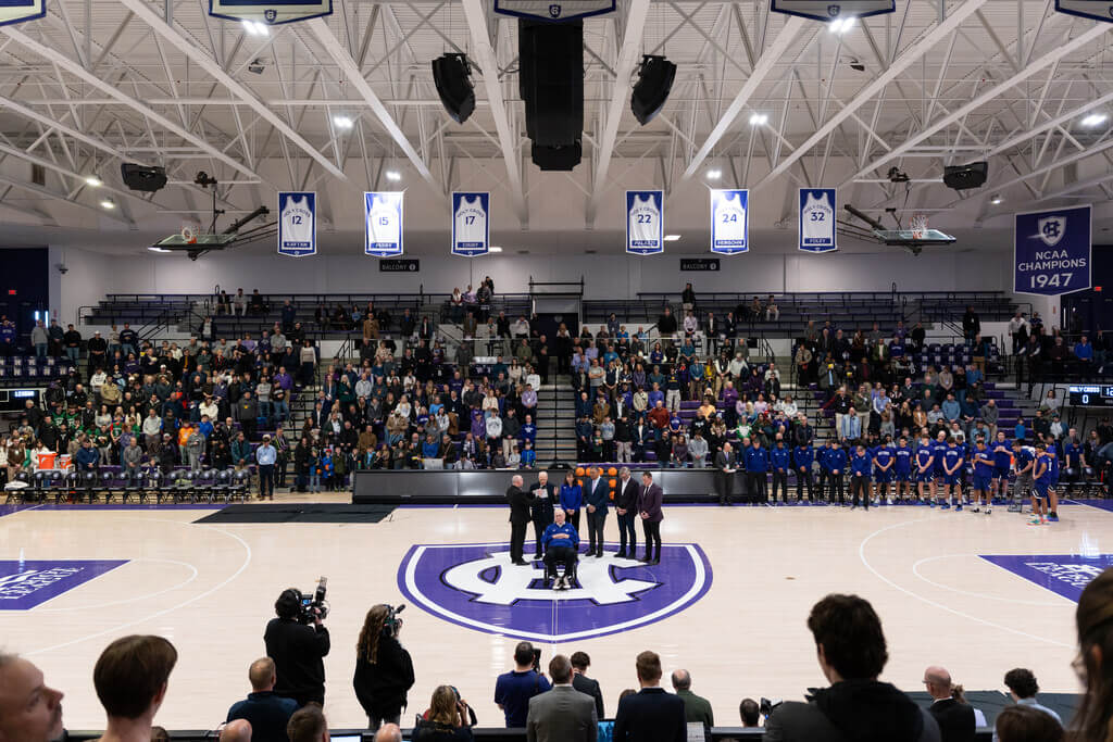 crowd surrounds basketball court