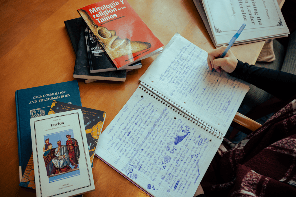 Books and notebooks on a table