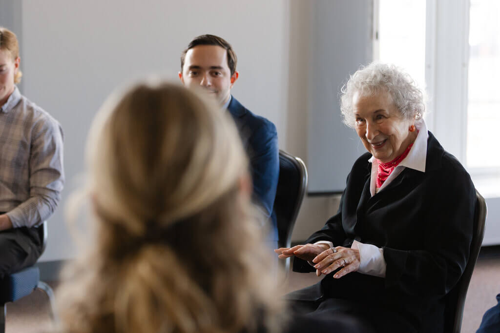 White haired woman speaking