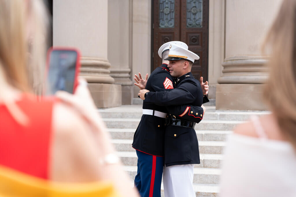 Two military officers hugging