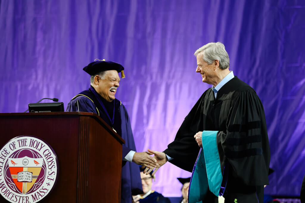 President Rougeau shaking hands with Charlie Baker