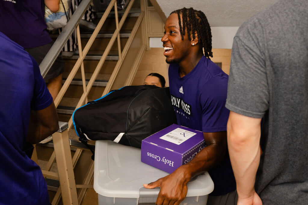 Student carrying boxes