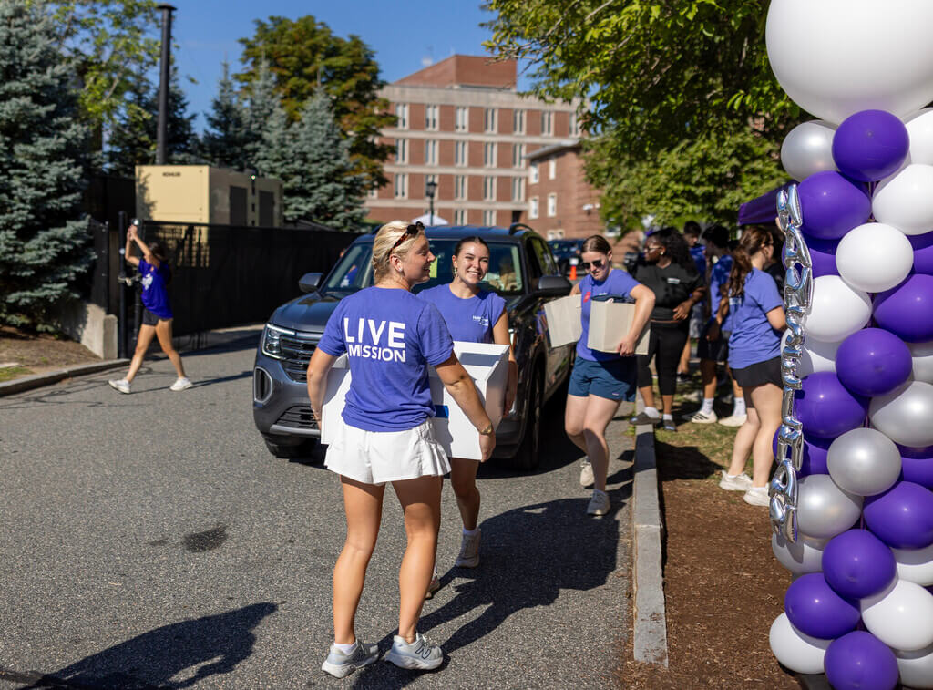 Students carrying boxes