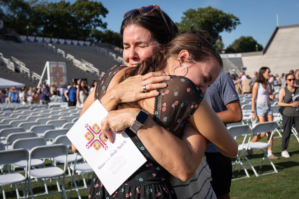 Mom hugging daughter