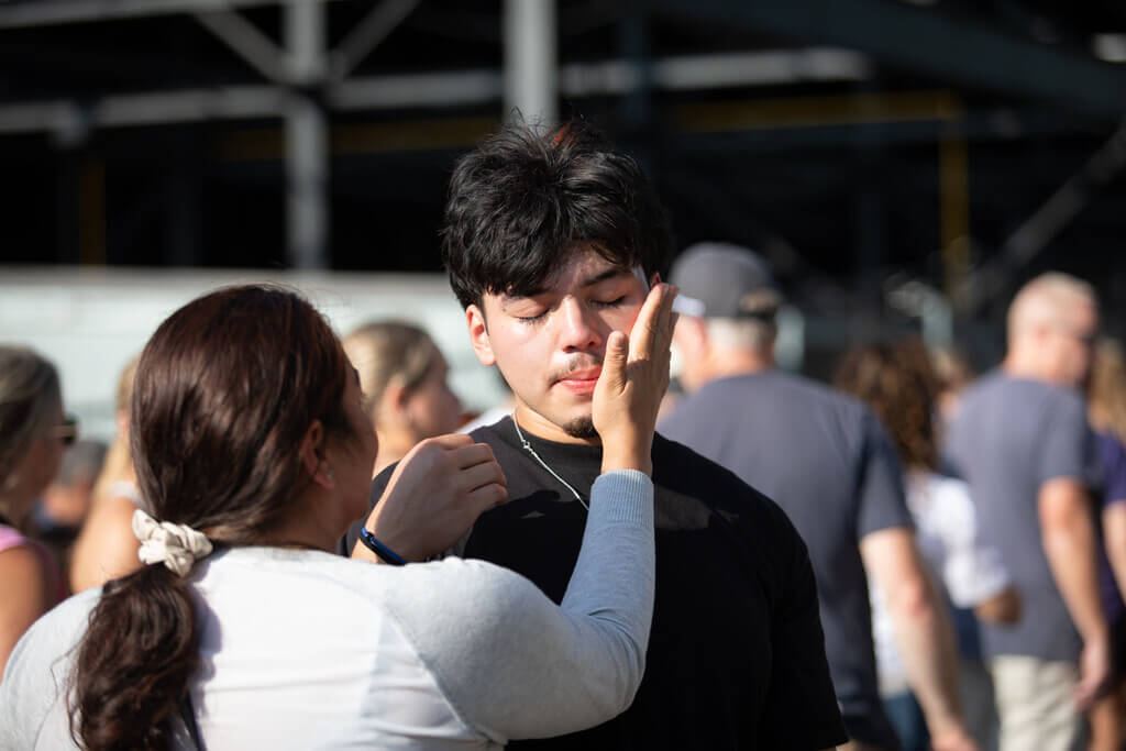 Mom patting son's face