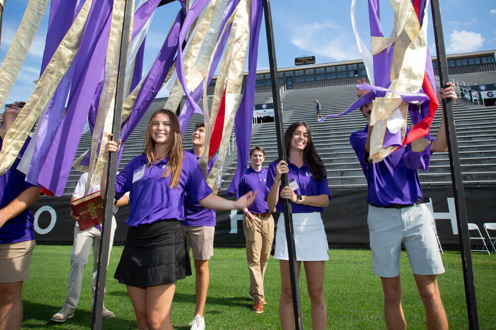Students carrying flags