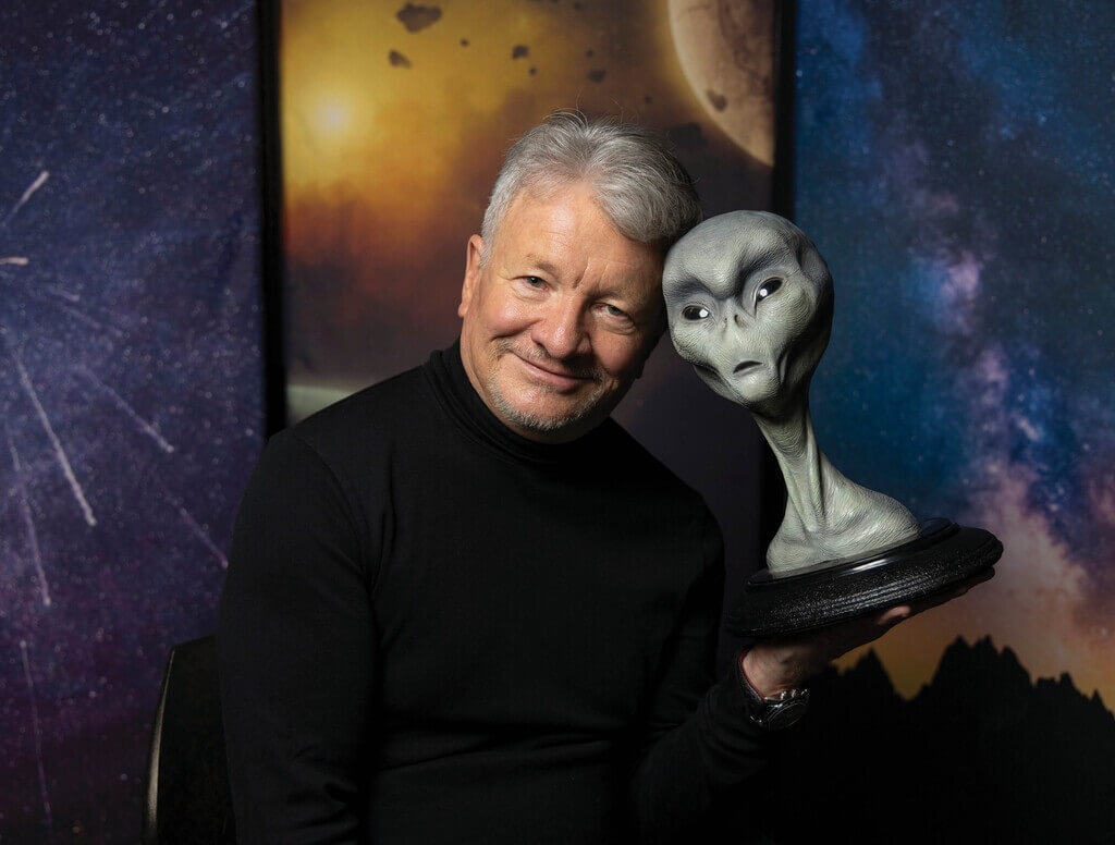 Bill Diamond holding an alien statue