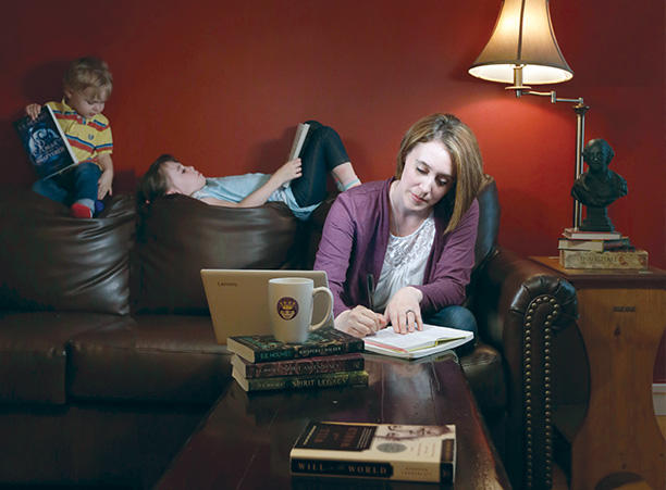Emily Strong Holmes on the couch with her kids