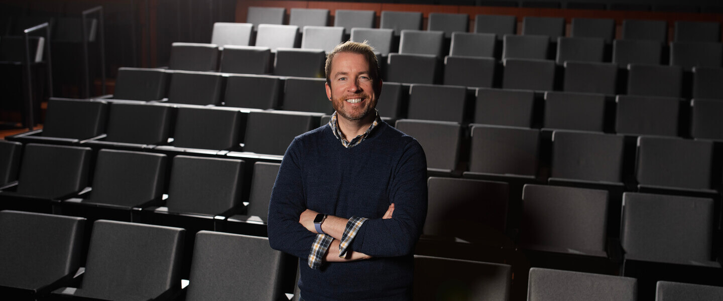 Man standing in a movie theater