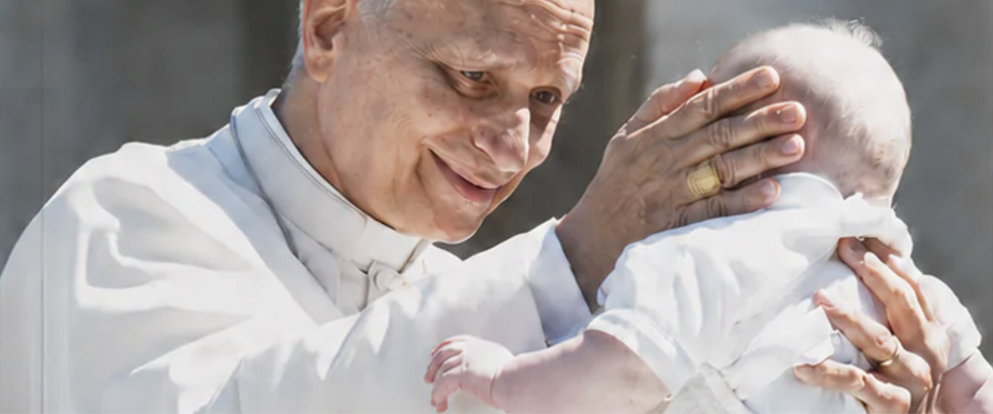 Pope Leo XIV blesses a baby