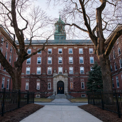 An old brick building sporting two wings