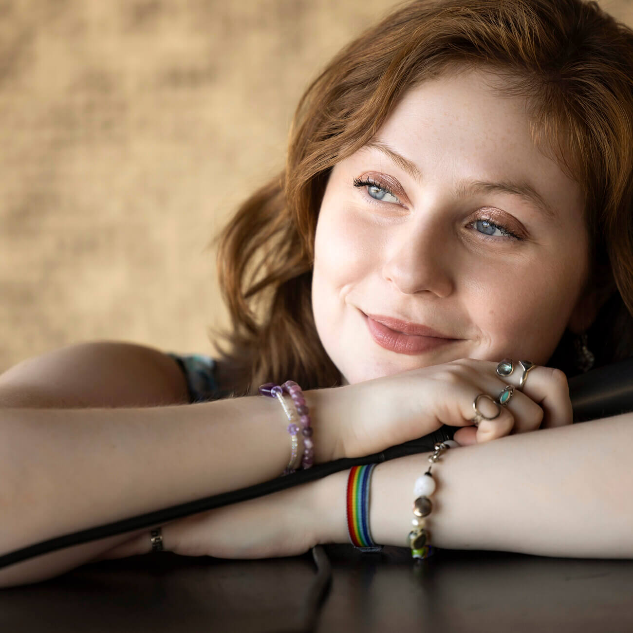 Woman rests her chin on her arms