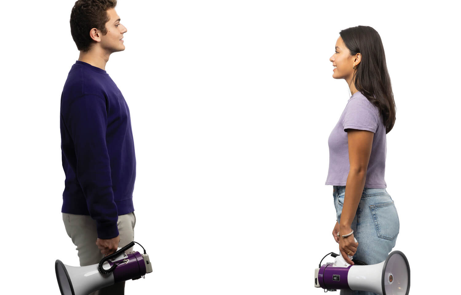 Man and woman stand opposite each other holding a bullhorn at their sides