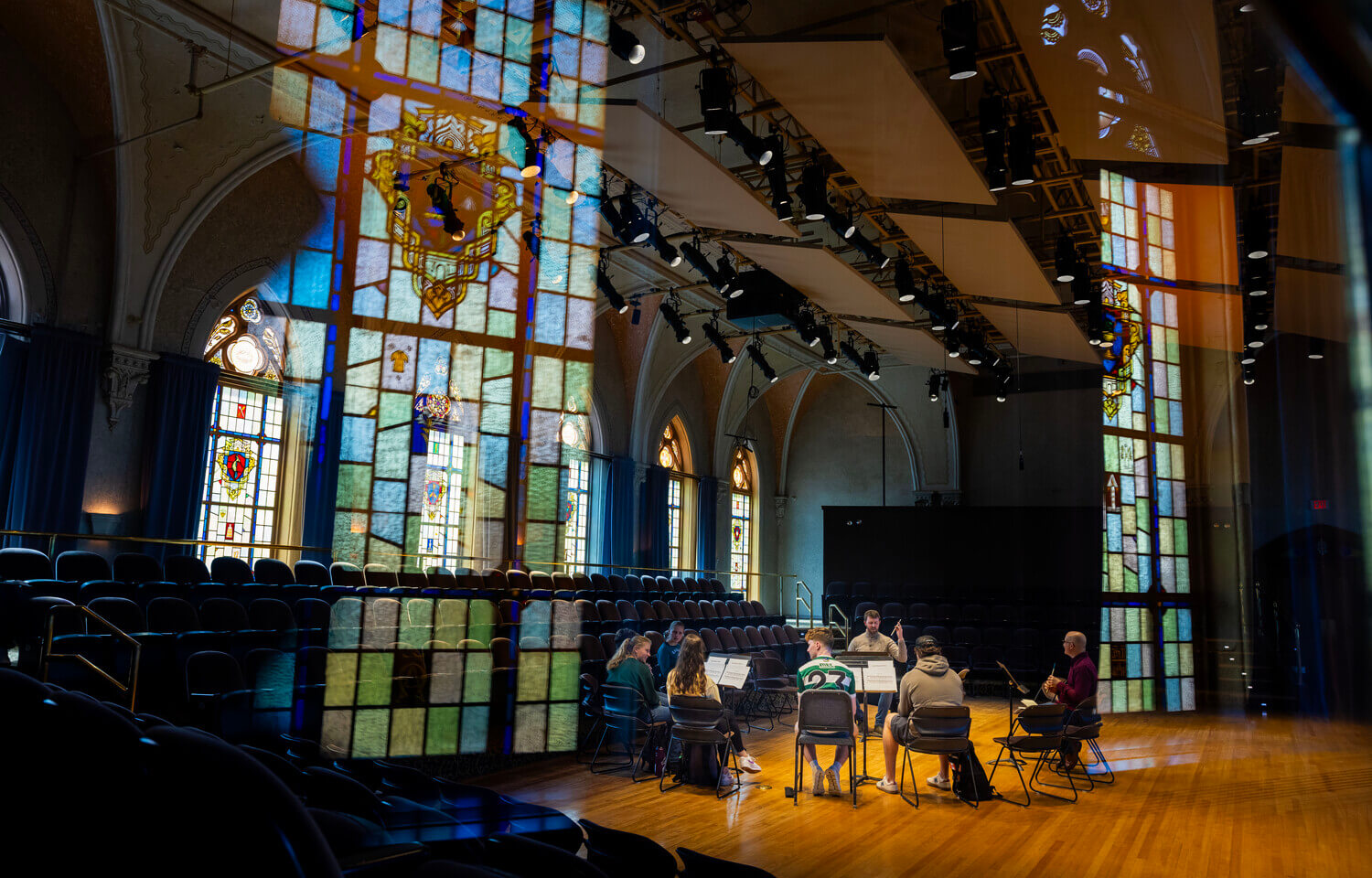 Musicians in a circle playing penny whistles