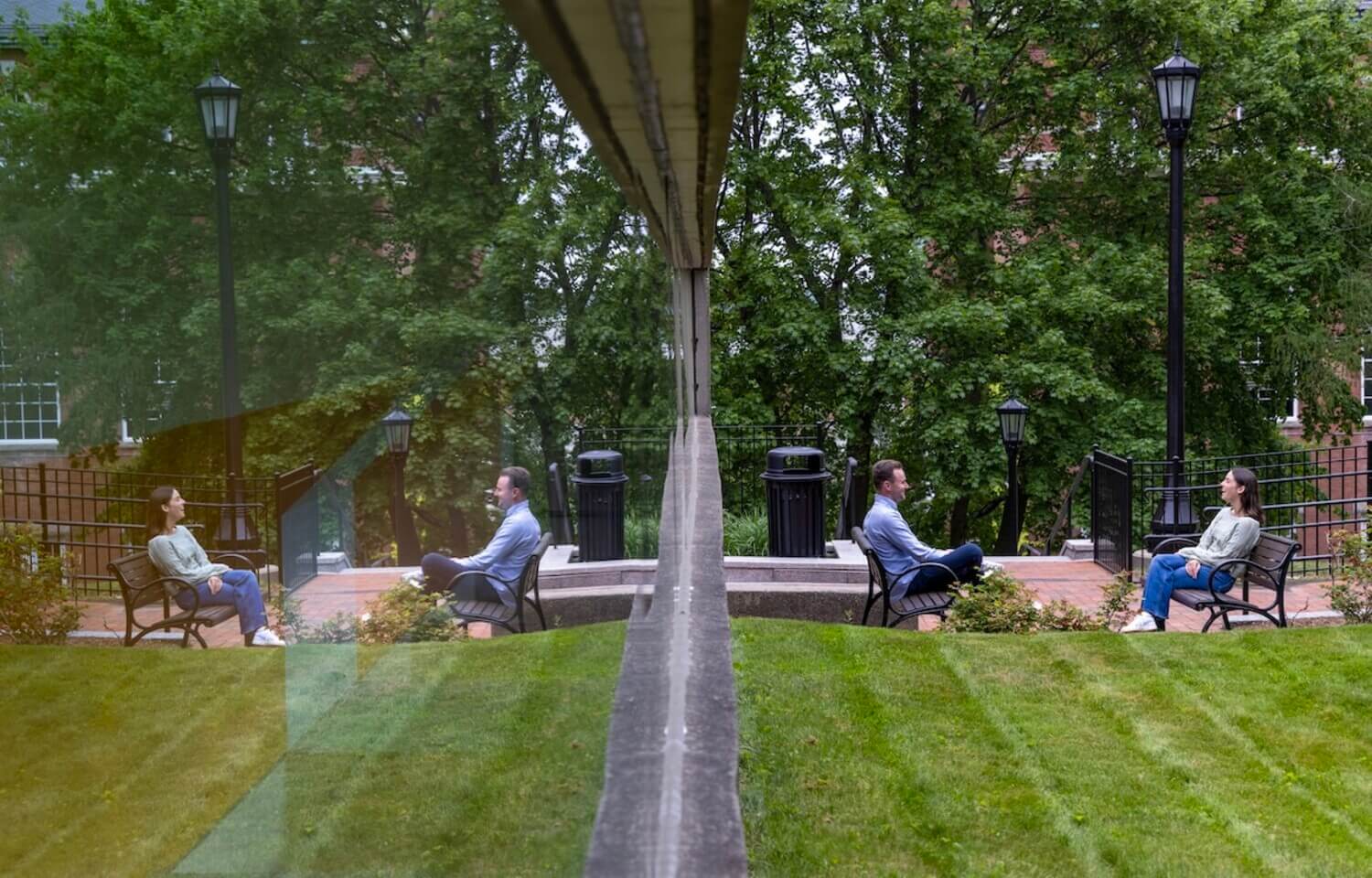 Two people sit across from each other in chairs