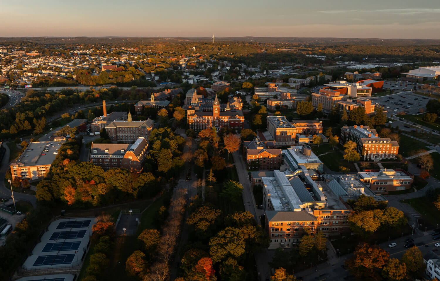 Aerial view of Holy Cross campus at sunset in the fall