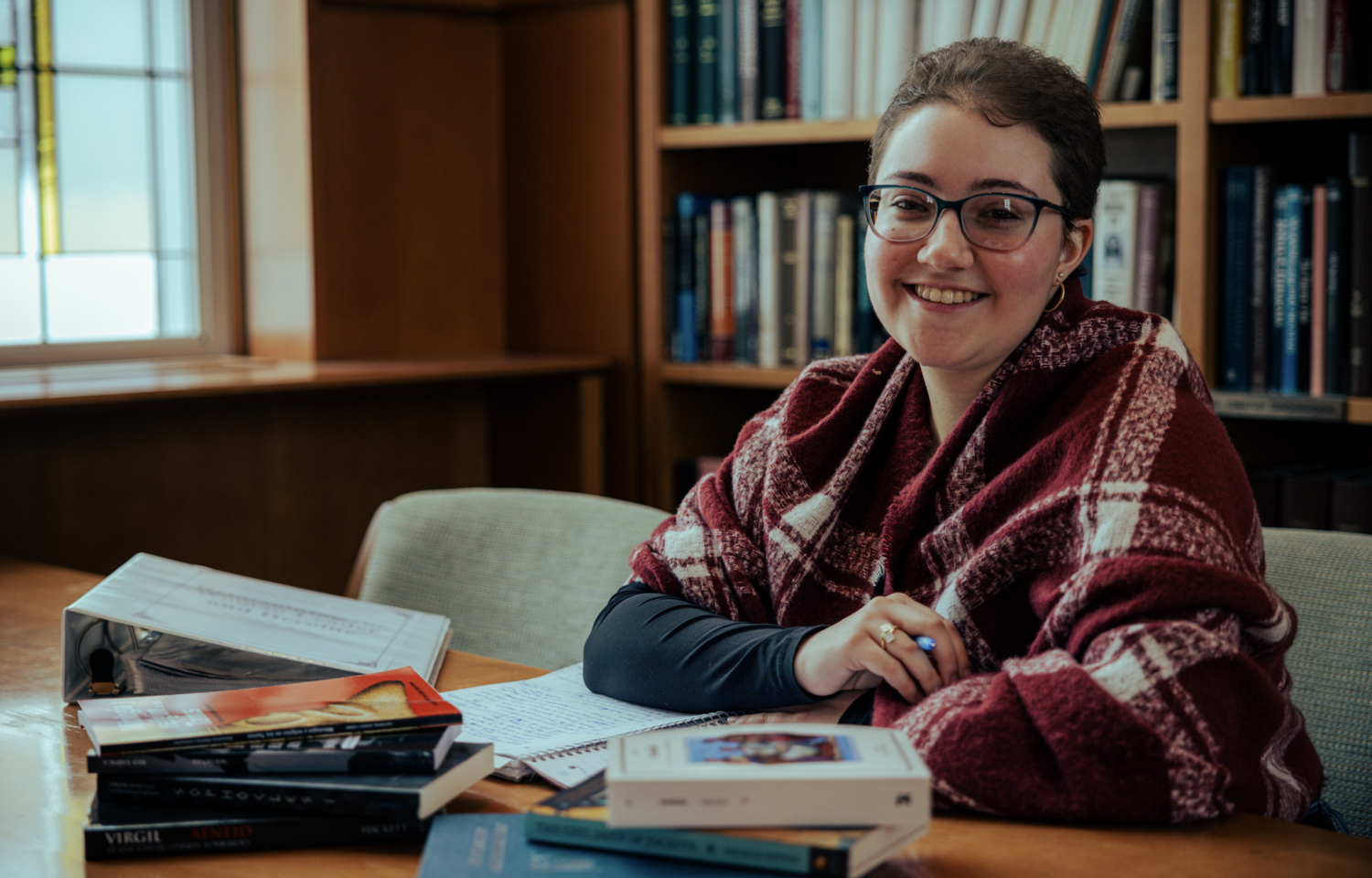 Student at desk with books