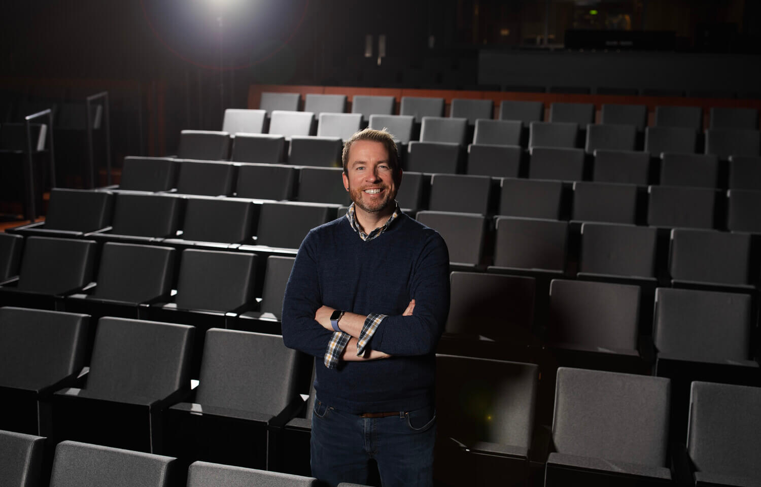 Man standing in a movie theater