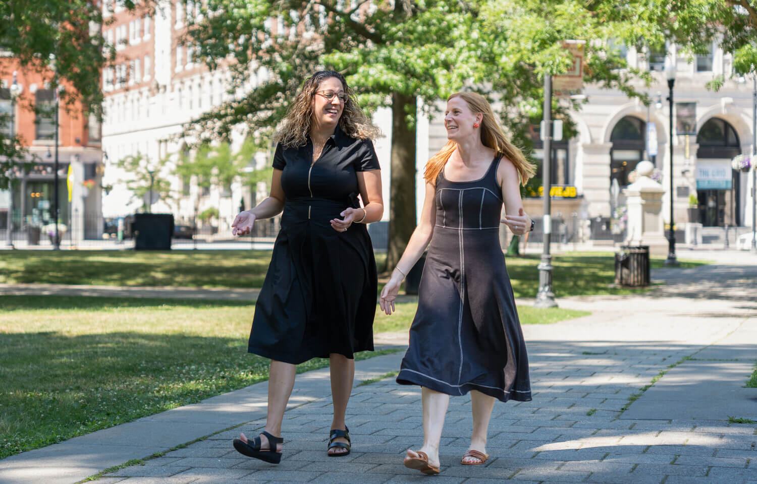 Two women walking in the Worcester Common