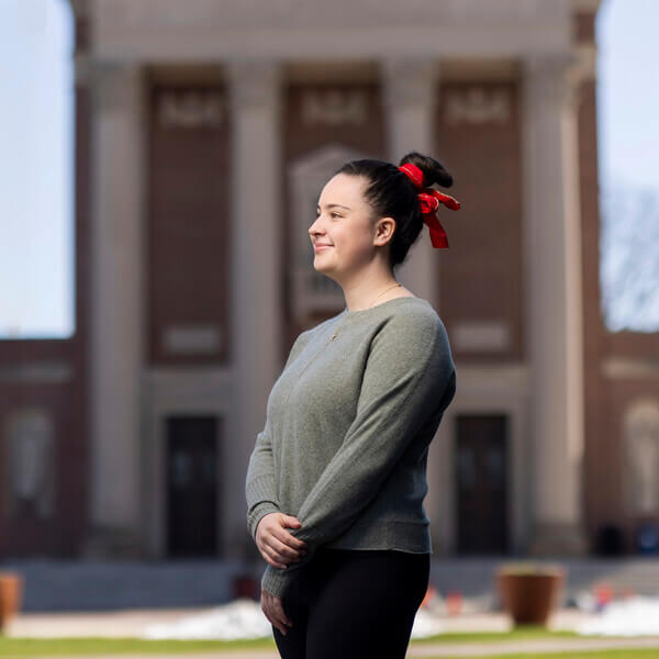 Carolyn Curtin ’25  photographed outside of St. Joseph’s Memorial Chapel on at the College of the Holy Cross on April 13, 2025.  (Photo by Michael Ivins/Holy Cross)