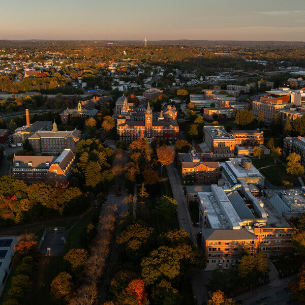 Aerial view of Holy Cross campus at sunset in the fall