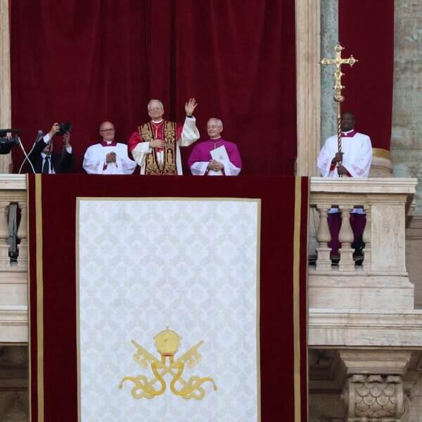 Pope stands on balcony