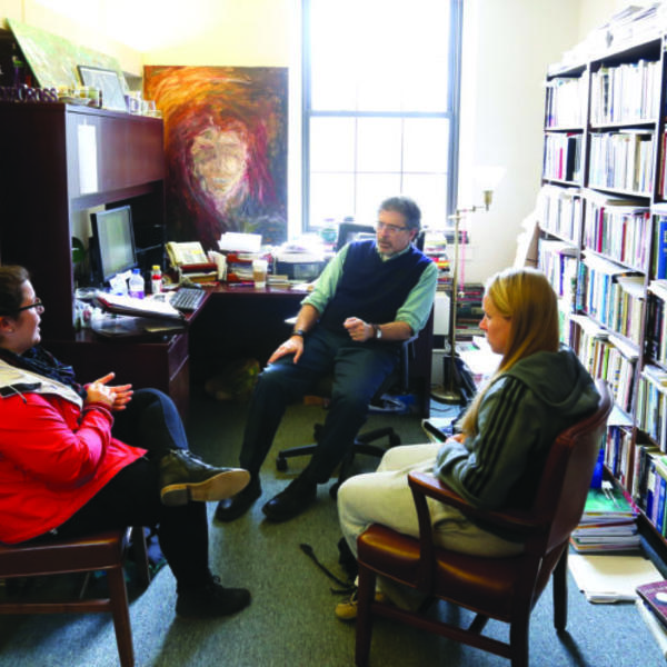 Student office hours with Mark Freeman, Holy Cross Distinguished Professor of Ethics and Society and professor of psychology. Photo by Tom Rettig