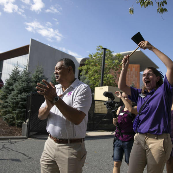 President Rougeau helps first-year students move onto campus during Class of 2026 move in day at Holy Cross on August 27, 2022. (Photo by Michael Ivins/Holy Cross)