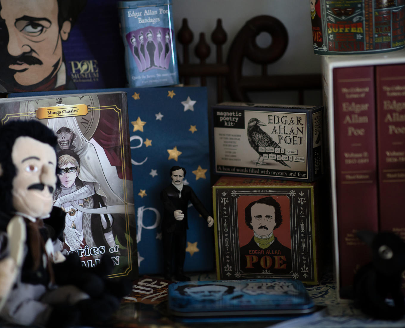 Detail images of Edgar Allen Poe paraphernalia on a shelf  