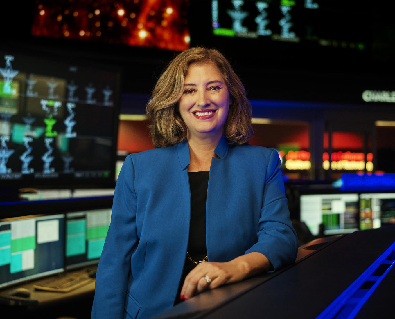 Headshot of woman in blue blazer