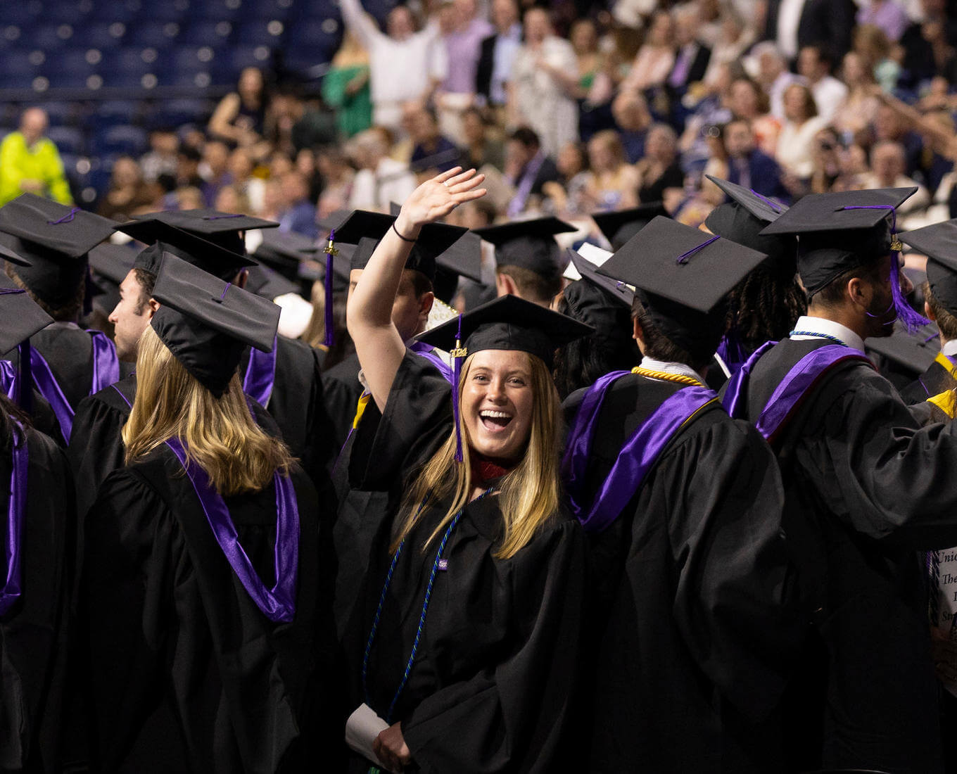 Woman student in cap and gown for a college graduation.