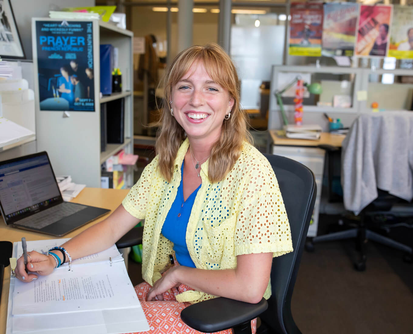 Woman sits at desk