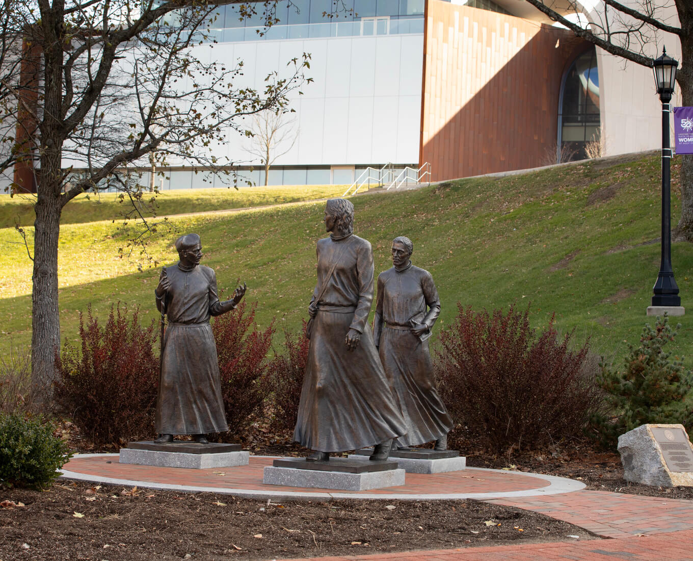 A statue featuring three men walking together
