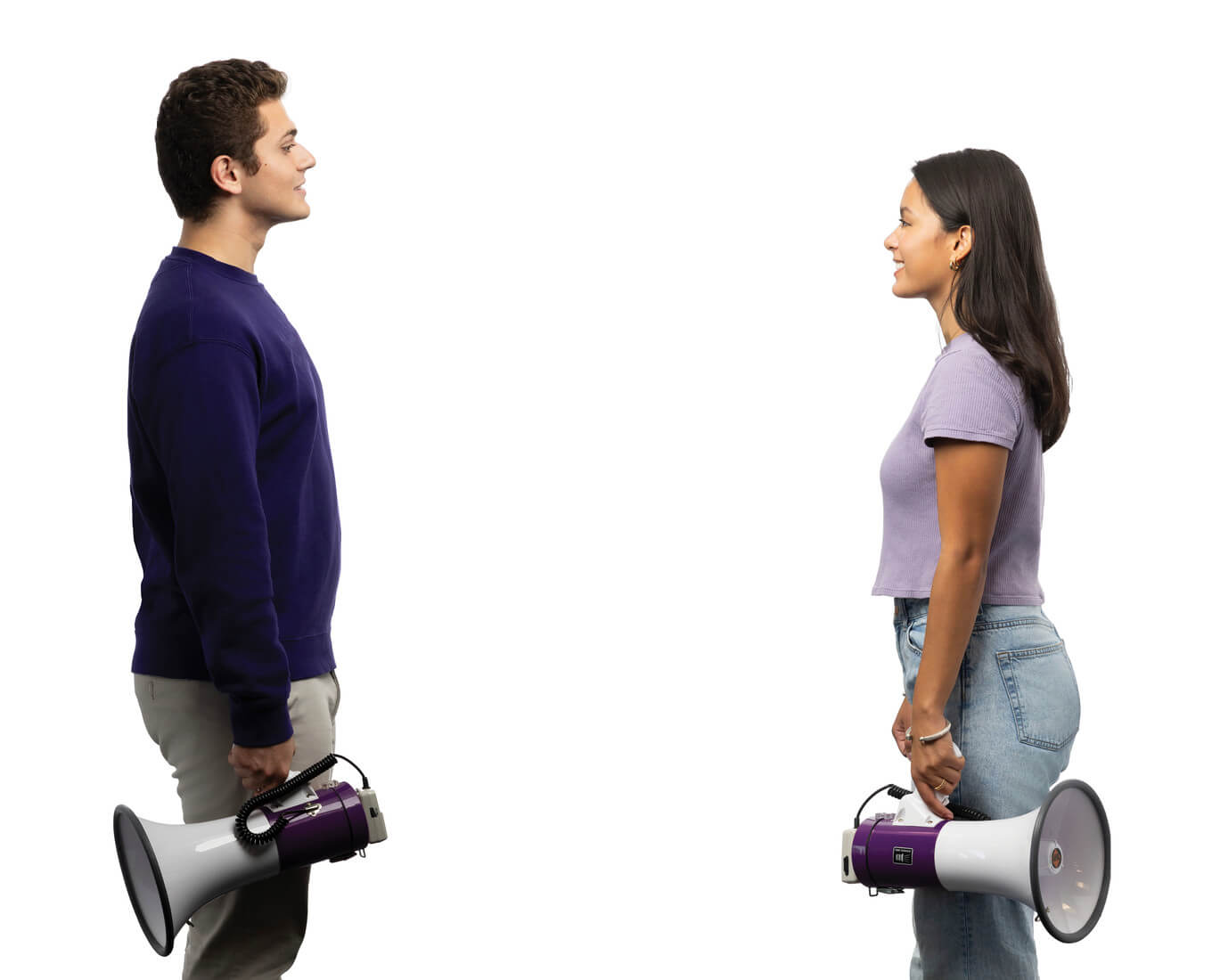 Man and woman stand opposite each other holding a bullhorn at their sides