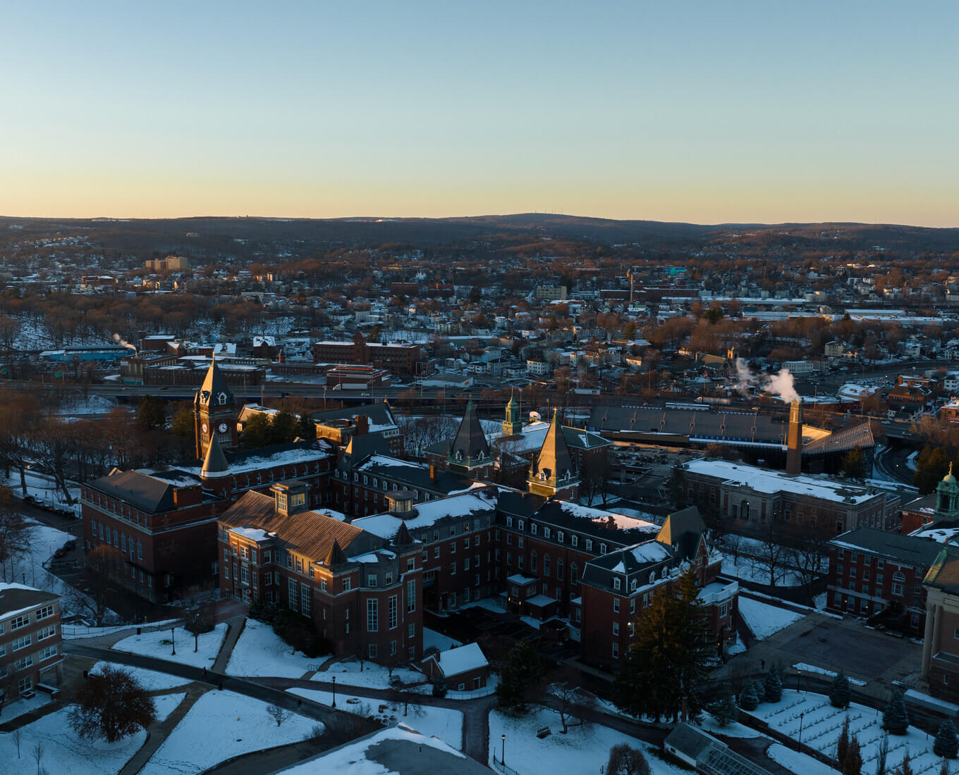 Aerial drone photo of the Holy Cross campus showcases the former Rotmans property which can be seen adjacent to the highway. Photo by Avanell Chang