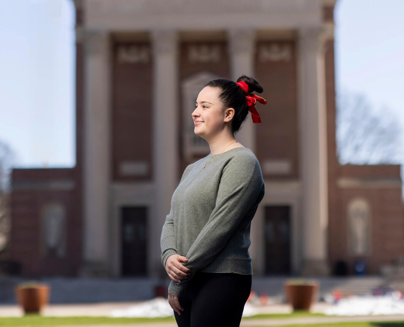 Carolyn Curtin ’25  photographed outside of St. Joseph’s Memorial Chapel on at the College of the Holy Cross on April 13, 2025.  (Photo by Michael Ivins/Holy Cross)