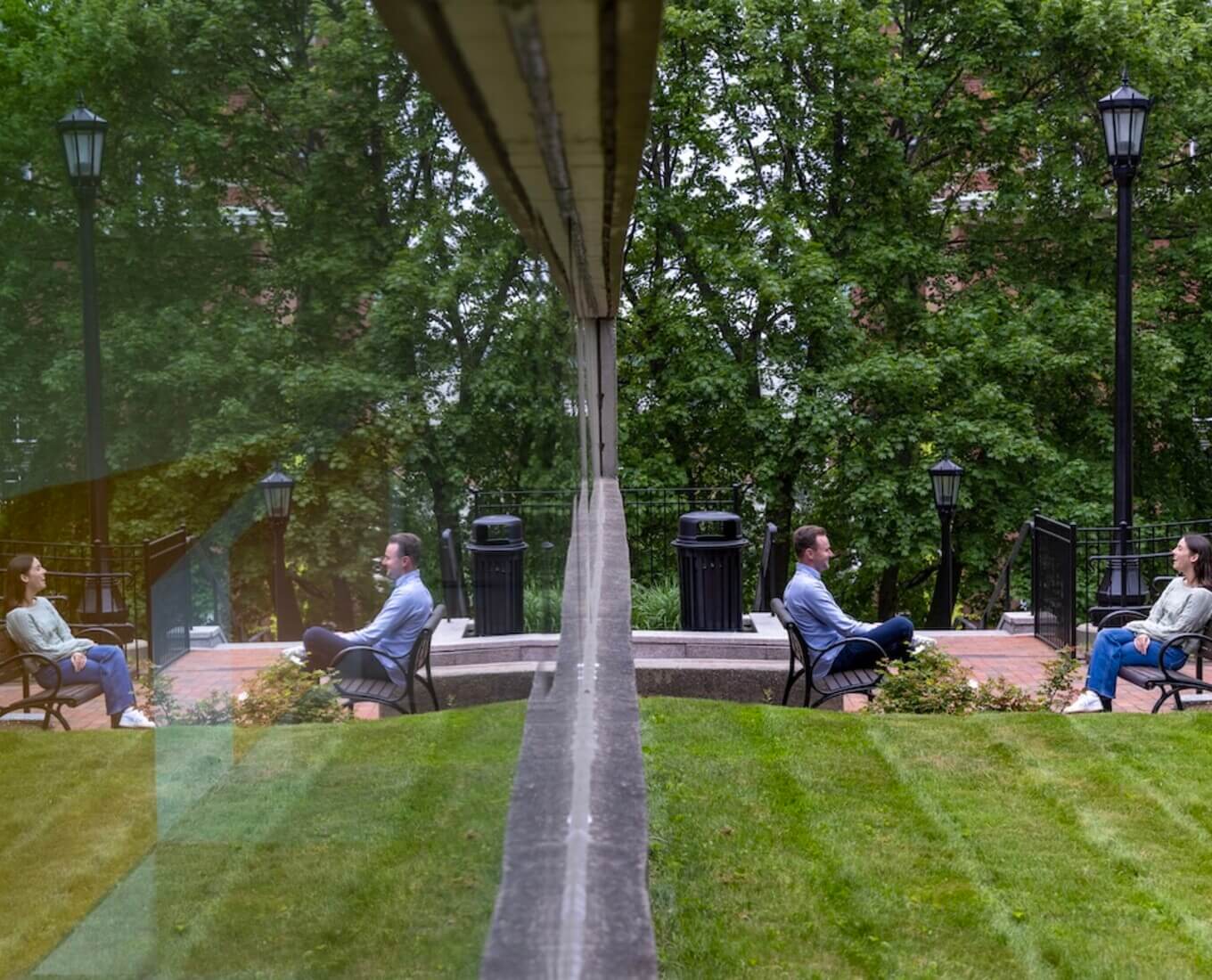 Two people sit across from each other in chairs