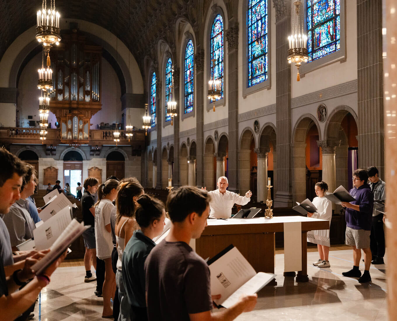 Students singing Gregorian chant in St. Joseph Chapel