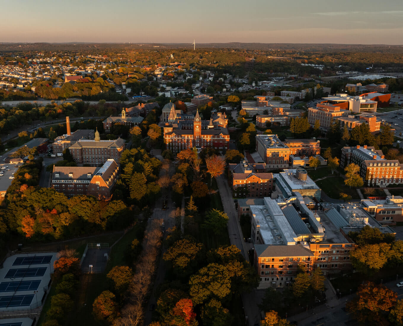 Aerial view of Holy Cross campus at sunset in the fall