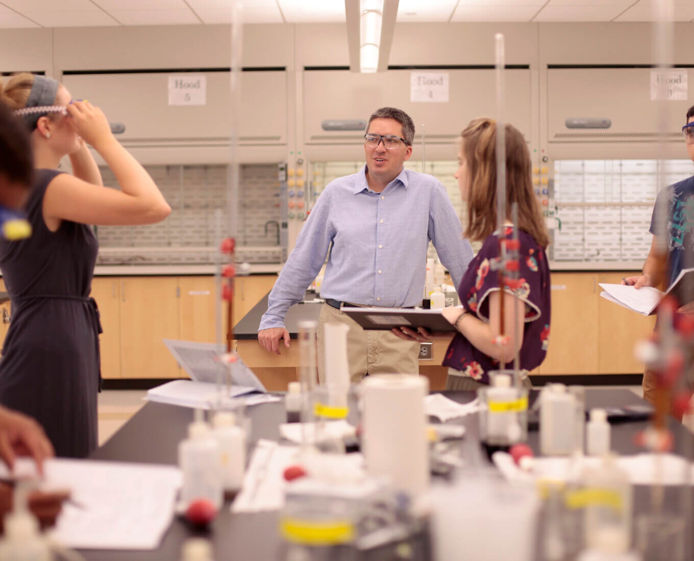 Ken Mills and students in a classroom