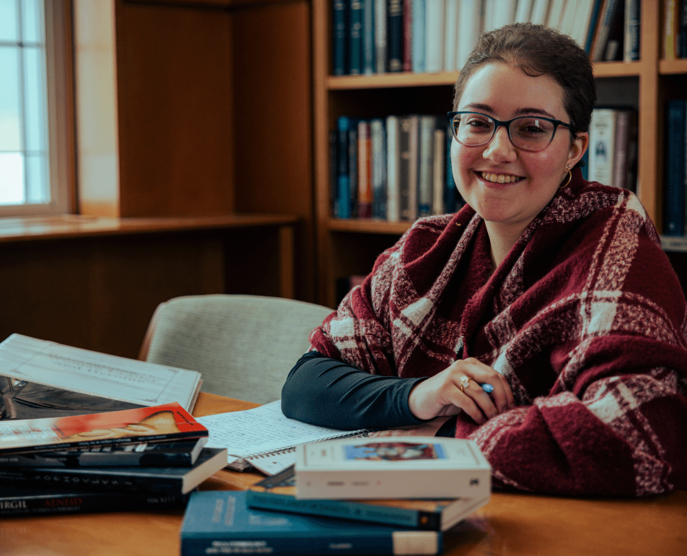 Student at desk with books