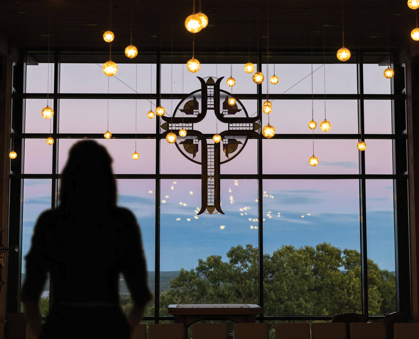 Silhouette of a person in front of the window at the Joyce Contemplative Center