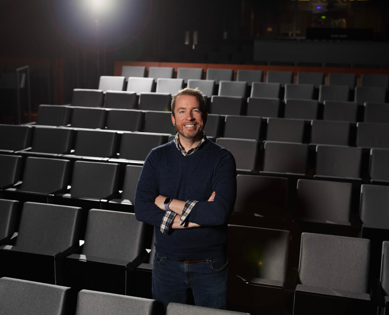 Man standing in a movie theater